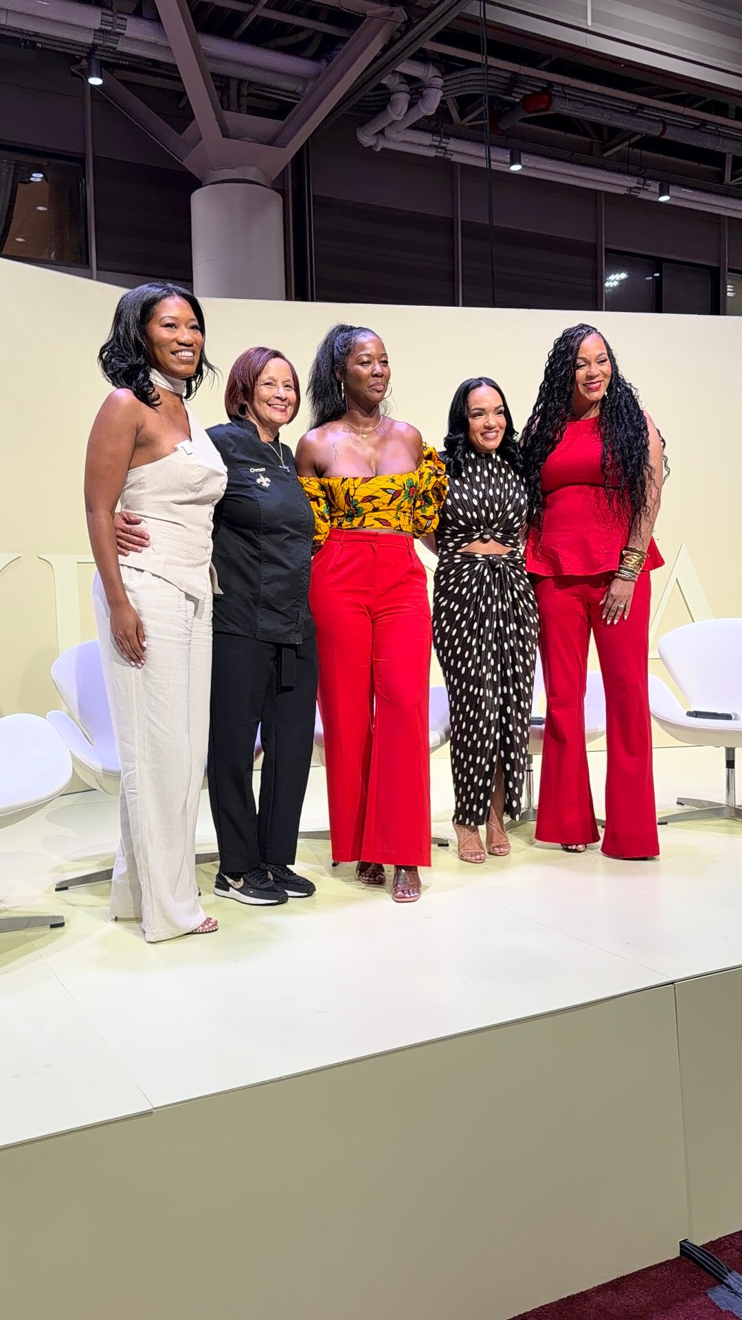 Panelists and executives gathered on stage at the ESSENCE Festival of Culture